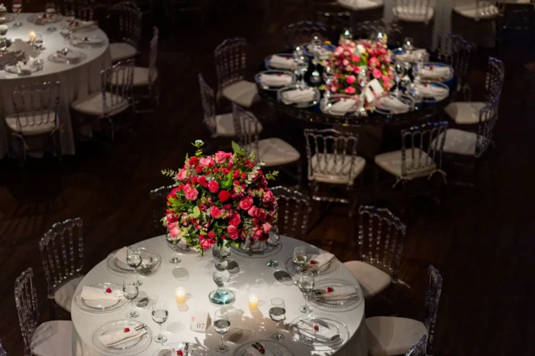 Wedding reception tables with centerpieces and candles — 30-guest wedding reception under $3,000