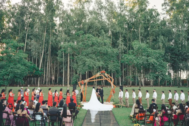 Outdoor wedding ceremony aisle among trees — backyard wedding checklist